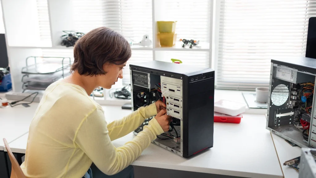 close up woman repairing computer chips